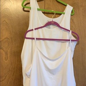 Two woman’s size sleeveless tanks